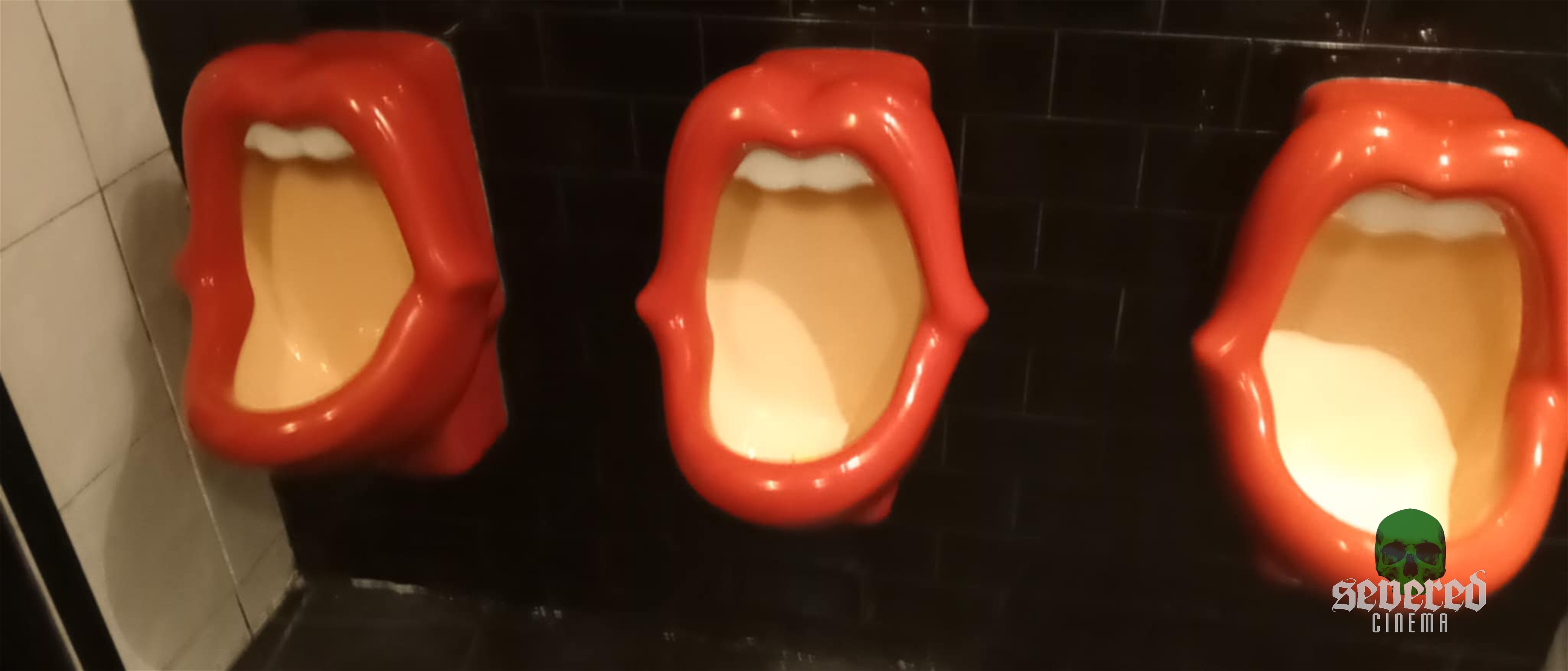 Urinals shaped like mouths.