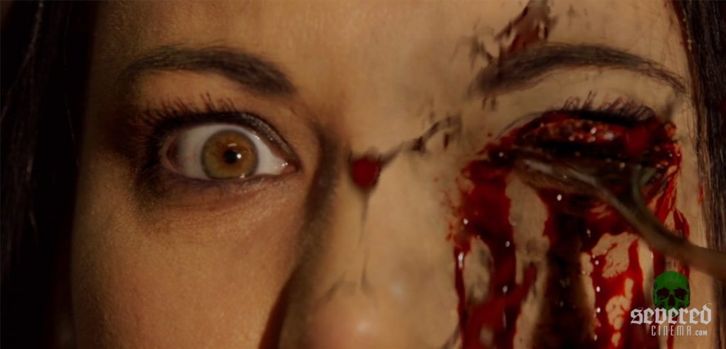 Brimstone Incorporated movie screenshot of eye gouged out with a spoon