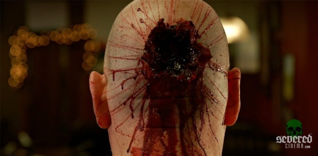 Brimstone Incorporated movie screenshot of a bald man shot in the head