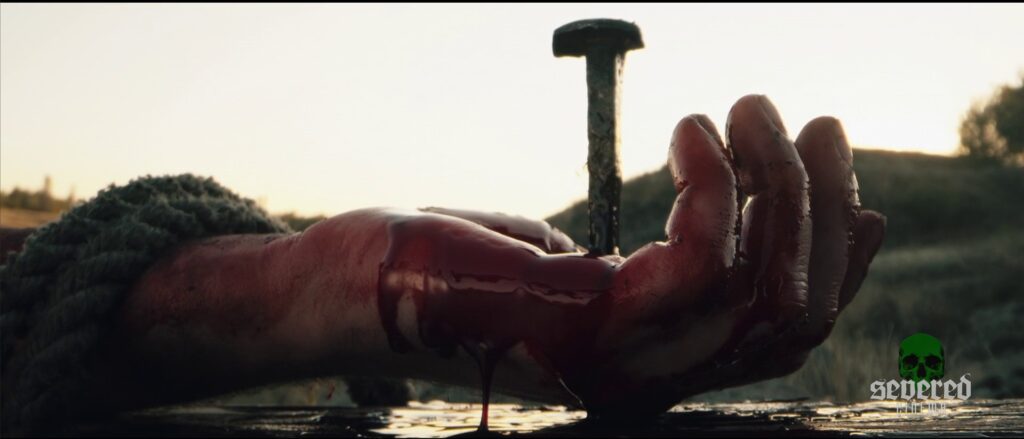 Jesus carrying the cross in Michael Moutsatos' movie Chameleon.