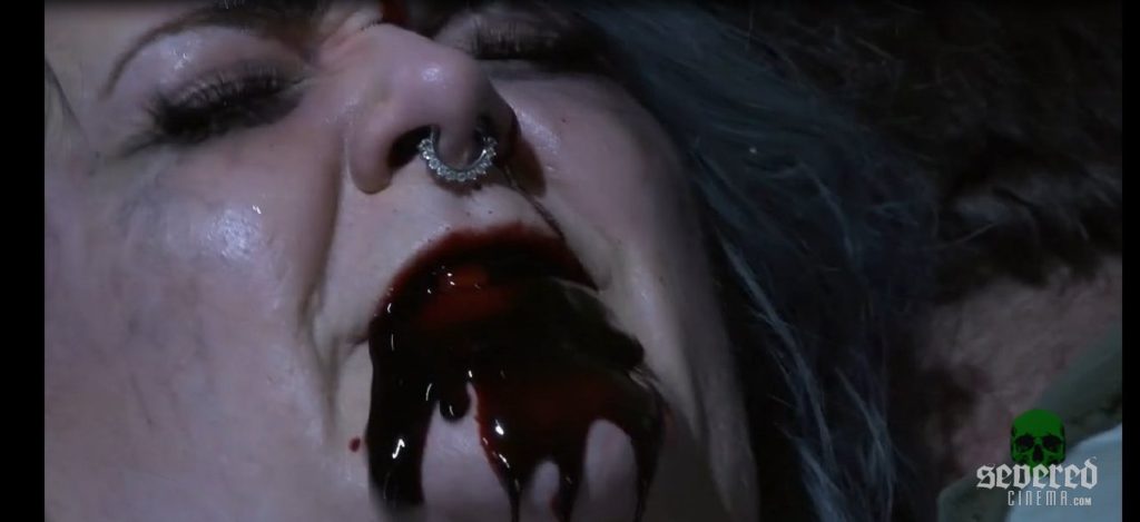 Woman's mouth bleeding in the movie Final Caller
