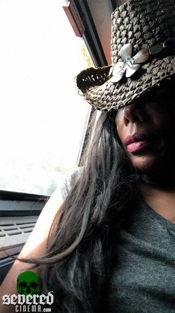 Geretta Geretta wearing a fancy hat