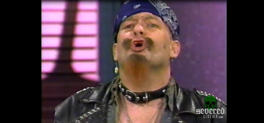 GG Allin wearing blue bandana