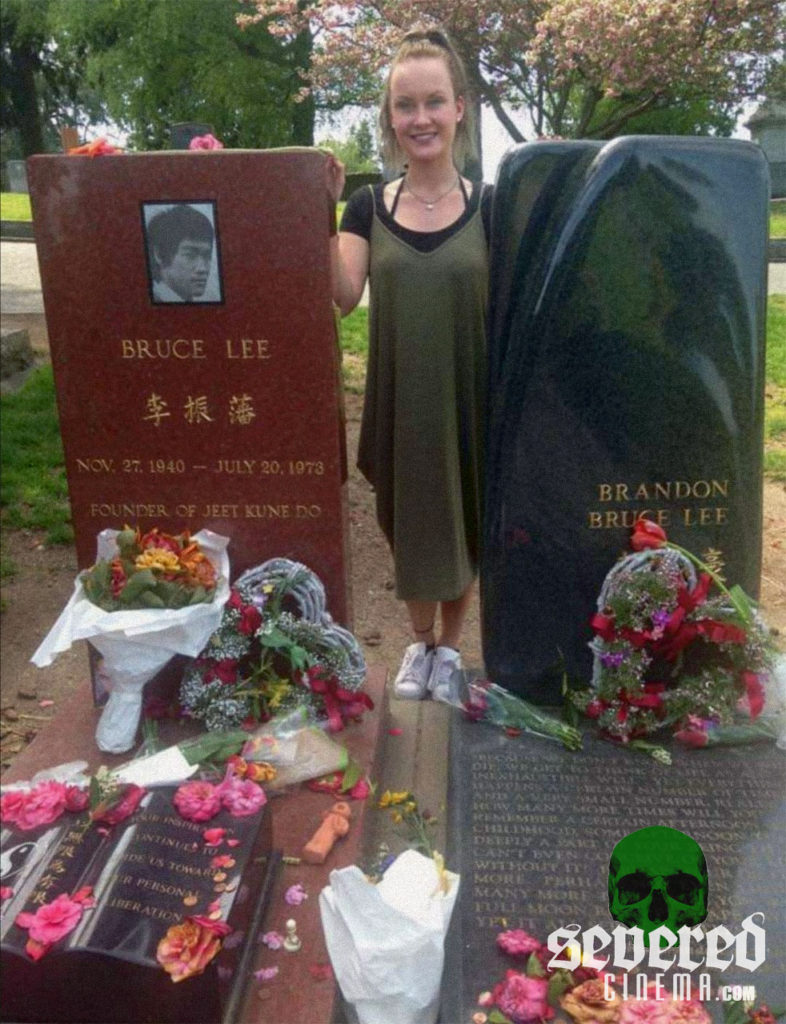 Laura Ellen Wilson paying her respects at Bluce Lee and Brandon Lee's graves