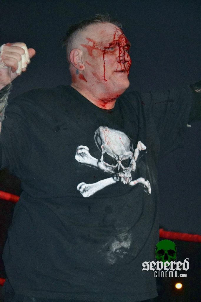 Mad Man Pondo with blood covered face