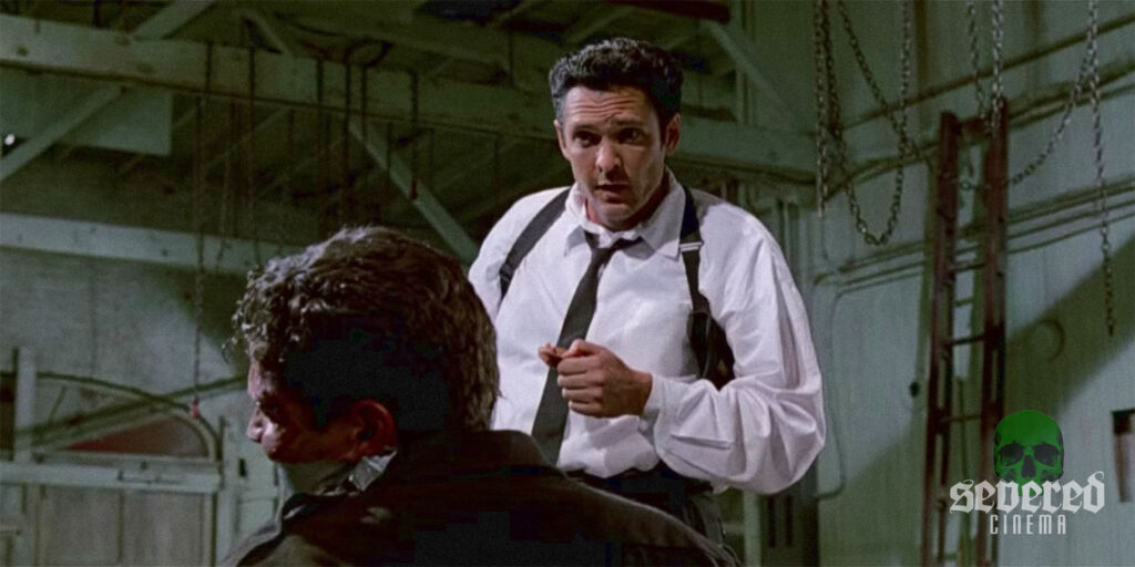 Michael Madsen as Mr. Blonde in Reservoir Dogs, the infamous ear scene.