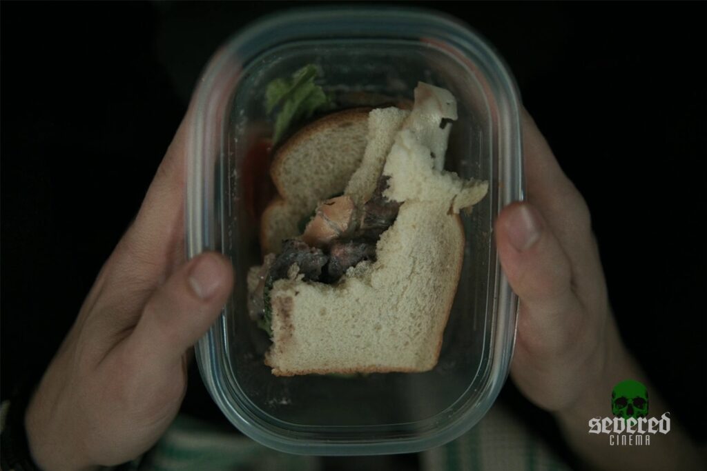 Obsession movie screenshot of the cat sandwich
