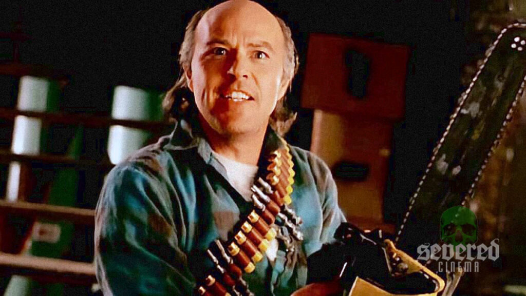 Reggie Bannister photo holding a chainsaw