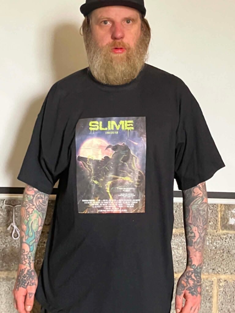 Rob Ceus wearing a Slime tee.