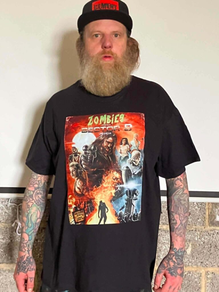 Rob Ceus wearing a Zombies from Sector 9 tee.